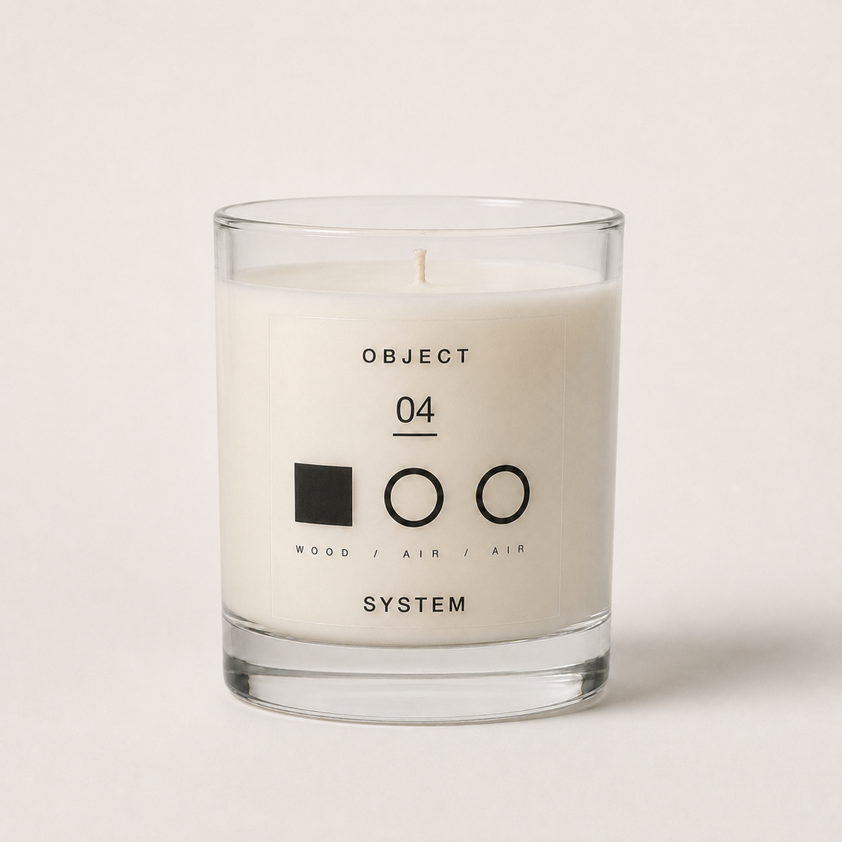 OBJECT 04 wood and air scented candle in a clear glass vessel